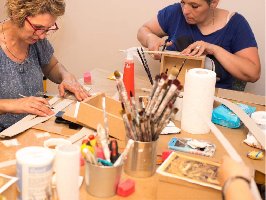 two women creating artefacts