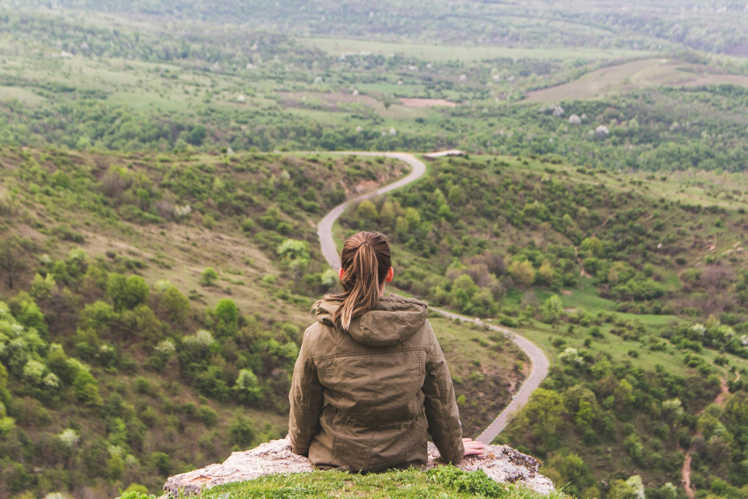 woman sitting on a rock